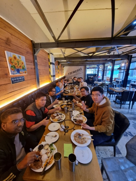 Lab members having a dinner after lab activities.